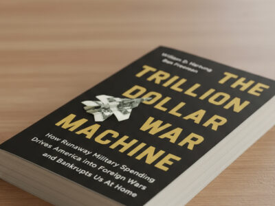 A photo of a the book Trillion Dollar War Machine sitting on a desk.